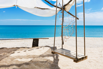 Swing by the azure sea