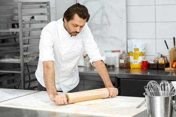 Professional pastry chef preparing croissants