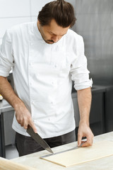 Professional pastry chef preparing croissants