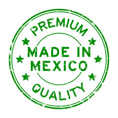 Grunge green premium quality made in Mexico round rubber seal stamp on white background