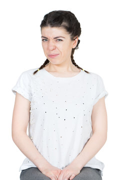 Woman in a white t-shirt feeling disgust