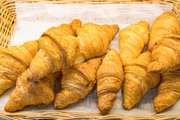 Croissants, traditional French pastry -  Selection of freshly baked pastry served for breakfast 