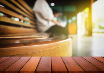 Selected focus empty brown wooden table and train station or transportation blur background image. for your photomontage or product display