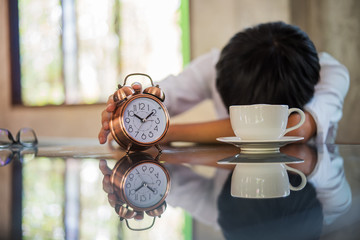 Naklejka premium Tired man sleeping at office having too much work