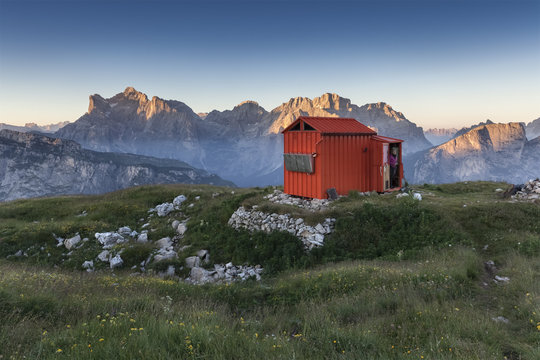 Europe, Italy, Veneto, Belluno, Agordino. Bivouac Margherita Bedin on First Pala di San Lucano at sunset, on the background Civetta and Moiazza, Dolomites
