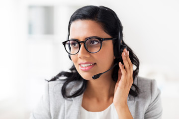 businesswoman with headset talking at office