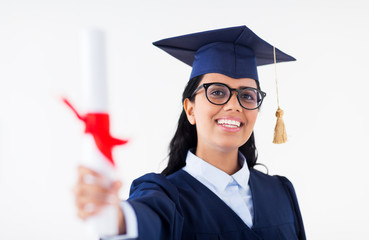 happy bachelor woman in mortarboard with diplomas