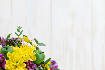 bouquet of flowers on a white wooden background. Copy space