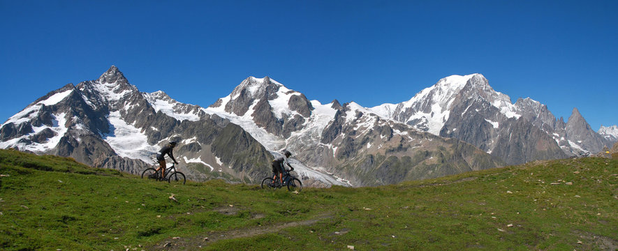 Mountain bike on the Alps, Col Chavannes, (Aiguille de Glacier, Aiguille de trelatete, Mont Blanc (Monte Bianco) on backgorund), Veny Valley, Italy, Europe