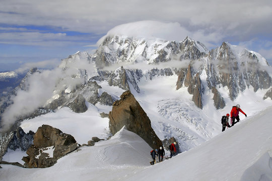 Mountaineers climbing Mont Blanc (Monte Bianco) massif (Mont Blanc on background), from Dente del Gigante gum, Aosta Valley, Italy, Europe