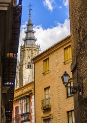 Fototapeta na wymiar Historical city of Toledo in Spain. To the background the tower of the cathedral
