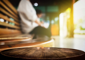 Selected focus empty brown wooden table and train station or transportation blur background image. for your photomontage or product display