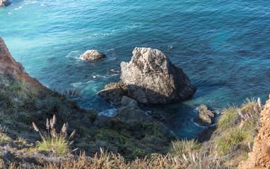 Fototapeta na wymiar Rocks in Pacific Ocean along Pacific Coast Highway
