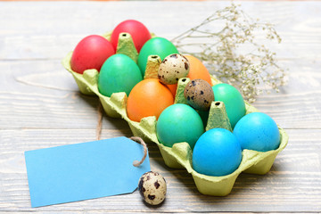 traditional eggs painted in bright color inside carton box