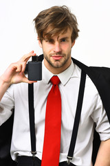 Naklejka premium Caucasian stylish man posing with perfume