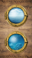 Two vertical ship windows with ocean surface and underwater