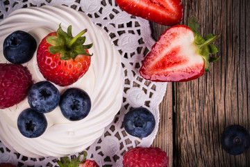 Summer fruit pavlovas on red ceramic platter