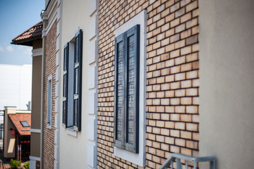 Fototapeta na wymiar Wall with windows in a brick house