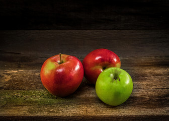 apples on an old wooden shelf still life