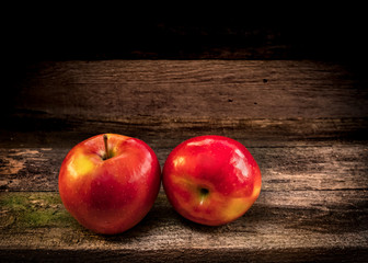 apples on an old wooden shelf still life