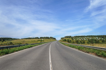 Fototapeta na wymiar Asphalt road in countryside