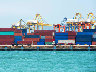 Fototapeta premium container ship in import export and business logistic.By crane ,Trade Port , Shipping, cargo to harbor, Aerial view, Top view.