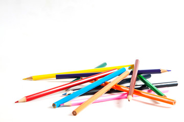 Close up of color pencils with different color over white background