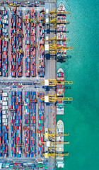 container ship in import export and business logistic.By crane ,Trade Port , Shipping, cargo to harbor, Aerial view, Top view.