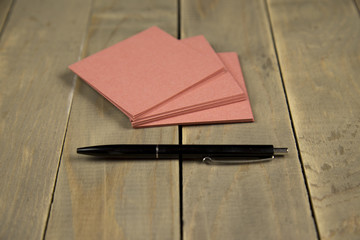 note on wood background with pen