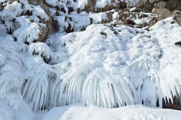 Russia, Baikal lake. Maloe Sea. Icicles  on the cape Khoboy on Olkhon island
