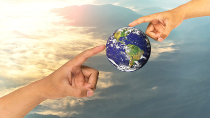 Hand with planet earth,Elements of this image furnished by NASA.