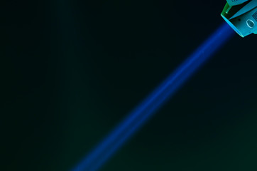 Beam of blue light on black . Applied to a searchlight torch