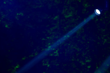 Beam of blue light on black . Applied to a searchlight torch