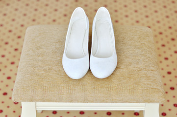 Closeup of a classic pair of white womens shoes