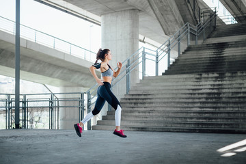 Woman running in urban environment  