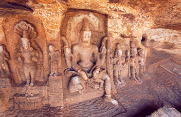 Lord Vishnu avatar Narasimha and other Hindu gods in natural cave in Badami town, India. Temple carvings made in 6th century, now Karnataka state