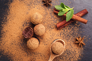 Chocolate truffle,Truffle chocolate candies with cocoa powder.Homemade fresh energy balls with chocolate.Gourmet assorted truffles made by chocolatier.Chunks of chocolate and coffee beans