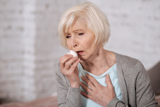 Closeup Of Elderly Coughing Woman