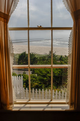 Yaquina Bay Lighthouse looking out the window at the jetty into Newport Oregon