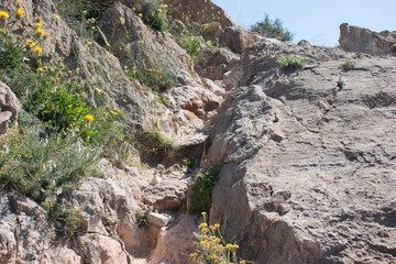A path leading to an abandoned castle on top of a mountain in Spain