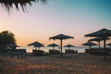 Sun over Hotel beach and sea