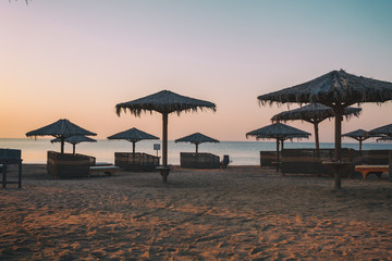 Sun over Hotel beach and sea