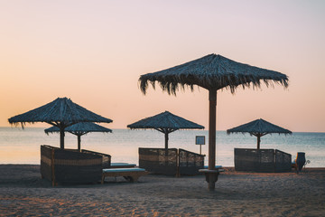 Sun over Hotel beach and sea