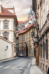 Fototapeta na wymiar Morning in old city narrow street without people and cars in Prague.