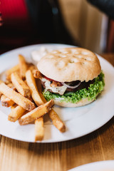 Delicious hamburger with fries