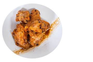 Sticky Chinese Chicken Wings with soy sauce and sesame. top view. isolated on white