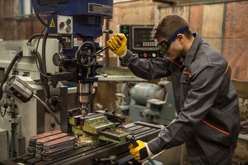 Professional engineer working at the metal production factory