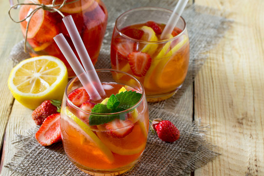 Fruit water. Refreshing summer drink with strawberries, lemon and mint. The concept of healthy and dietary nutrition.