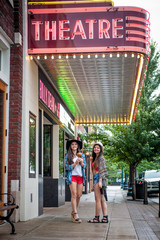 Friends walking down the street in a small town