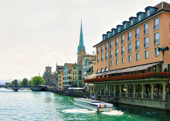 Fraumunster Church and ferry at Limmat in Zurich